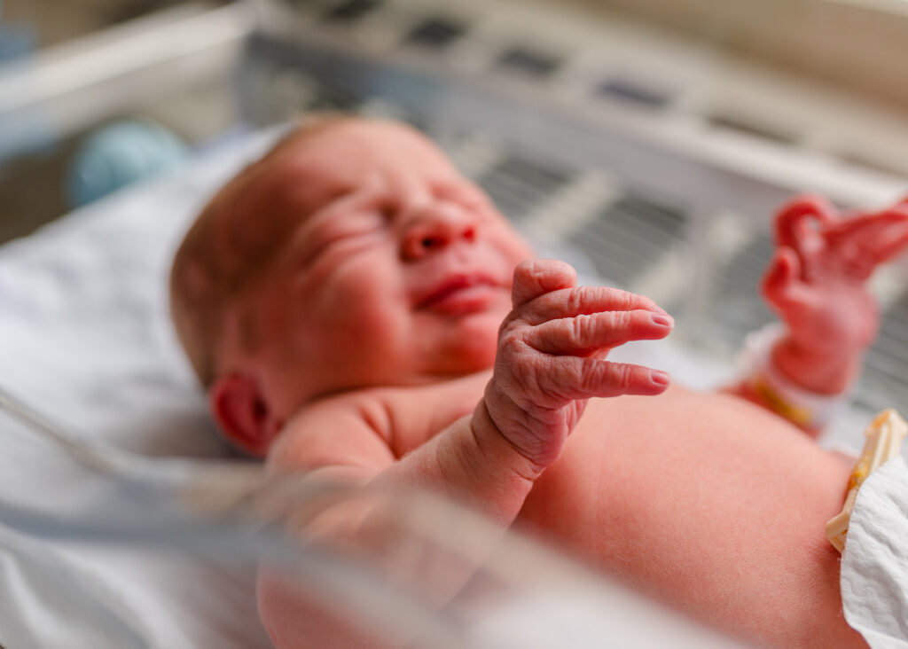fresh 48 newborn session in hospital bassinet in Little Rock